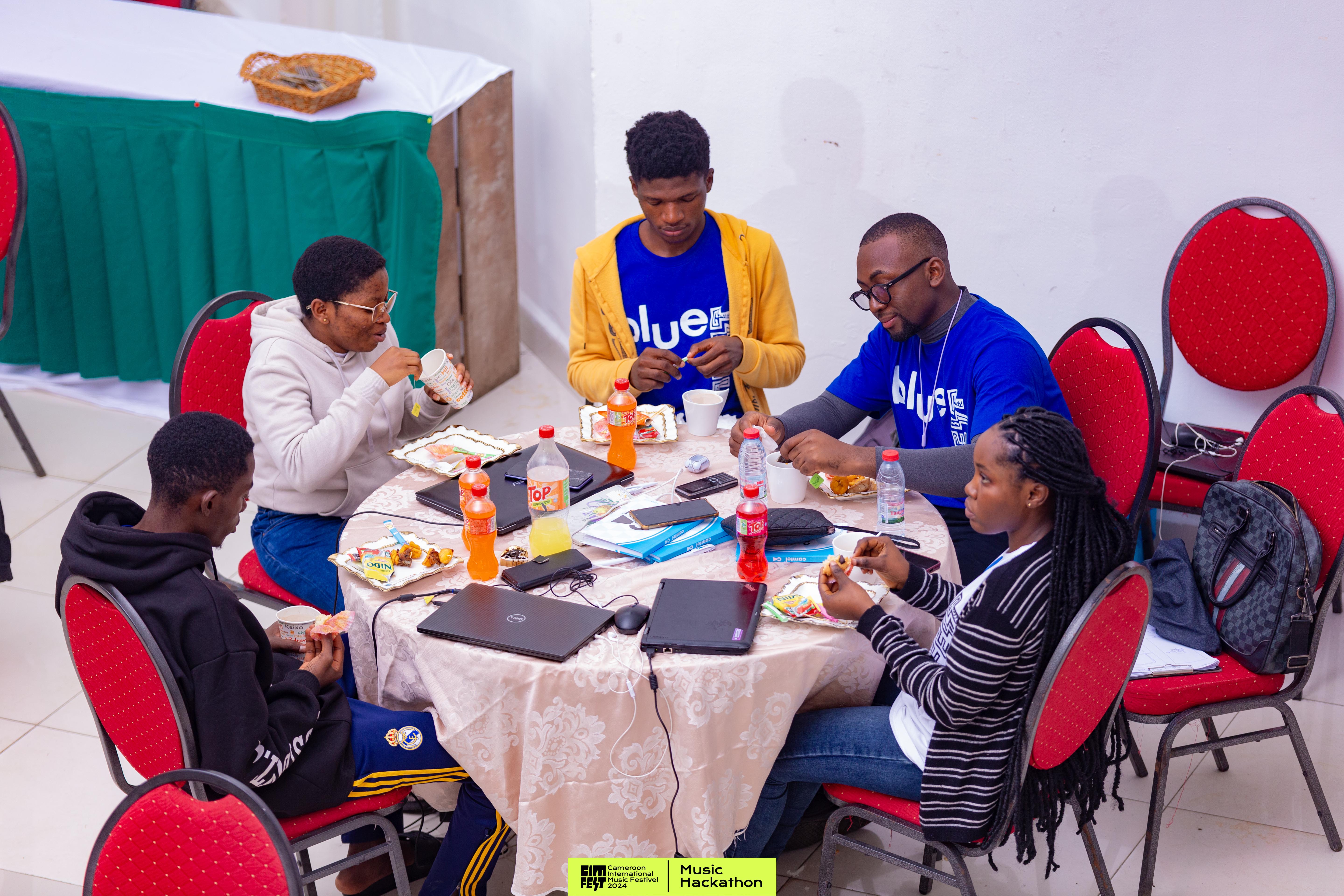 The team heads-down, building during the hackathon